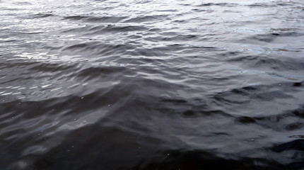 Waves on lake water surface.