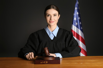 Female judge at table in courtroom