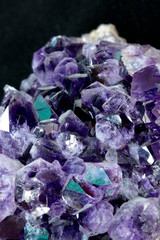 Purple Crystal Stone macro mineral. Purple rough amethyst quartz crystals geode