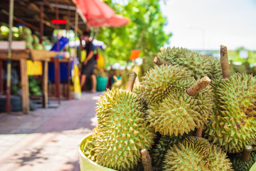 Close up many durian is in the basket in front of the market, Durian is a tropical fruit in Thailand that is very popular.