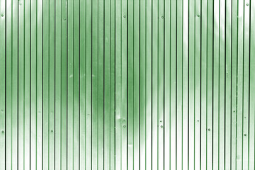 Metal list wall texture of fence in green tone.