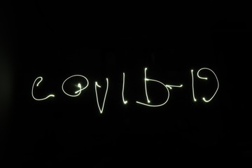 Handwritten word COVID-19 Light painting experiment