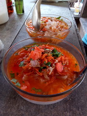 "Khao Tom Nam Daeng" (Steamed Rice with Extra-ingredient) is one of a Must Eat Unique Thai Local Food at Ban Sakhla, Samutprakarn Province, Thailand.