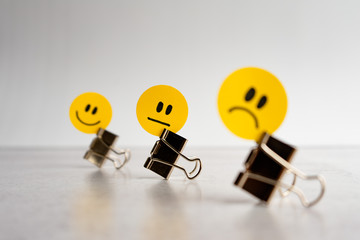 yellow paper unsatisfied face icon on paper clip