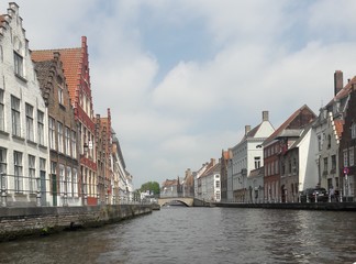 Fototapeta na wymiar Bruges Belgium water canal and historic buildings 2017