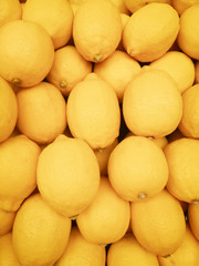 Colorful Of Organic Lemons In Supermarket. Yellow Citrus Fruit Lemon background.