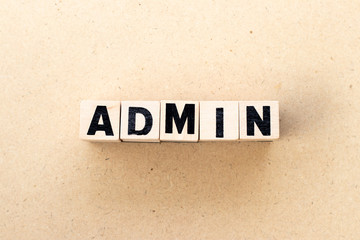 Obraz premium Letter block in word admin on wood background