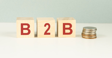 Acronym B2B- Business to Business. Wooden small cubes with letters isolated on white background with copy space available. Business Concept image.