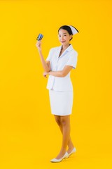 Portrait beautiful young asian woman thai nurse with credit card