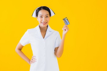 Portrait beautiful young asian woman thai nurse with credit card