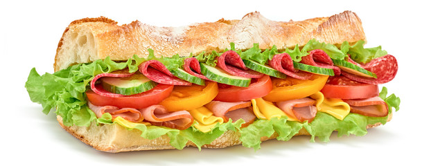 Submarine sandwich with ham, cheese, salami, tomato, lettuce salad, cucumber isolated on white....