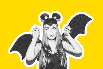 Beautiful young girl in a bat suit. Hand gestures of a girl in a bat mask. Collage black and white image yellow background. Coronovirus problems.