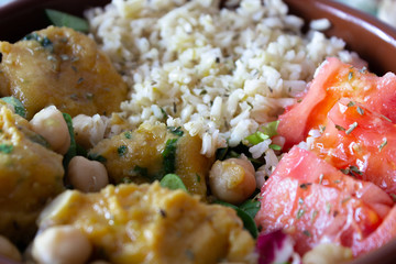 Vegan food. Meatballs of chickpeas, rice, tomato and salad.