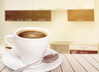 White cup of black coffee on the desk