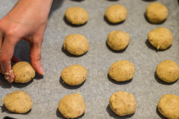 Placing cookies to be backed close up