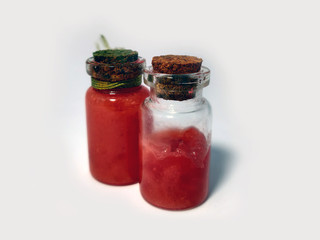 Potions with red liquid. Alchemy set with flasks. small glass bottles with colored liquid for game...