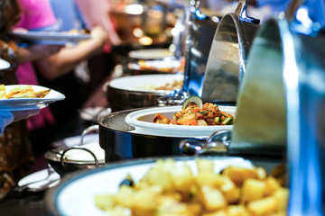 Crowd of people enjoying buffet food meal dining Food Options Eating Concept