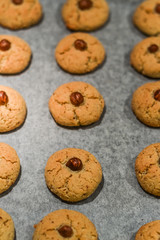 Hazelnut cookies on baking sheet close up