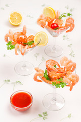 Glass with shrimp and tomato sauce on table, closeup. Healthy appetizing food.