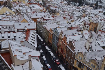snow colorful houses and road in the middle view from above