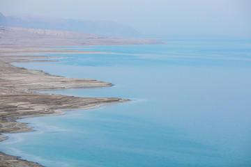 Obraz premium landscape of the Dead Sea, failures of the soil, illustrating an environmental catastrophe on the Dead Sea, Israel