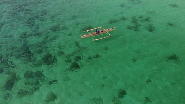 Flying over fisherman's boat next to Bantayan island, Cebu, Philippines