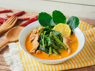Morning glory vegetable curry with pork meat, traditional Thai food.