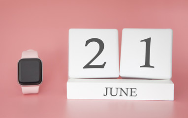 Modern Watch with cube calendar and date 21 june on pink background. Concept summer time vacation.