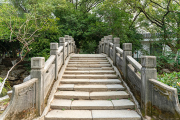 ancient stone bridge over river,China