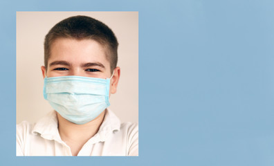 Portrait of a Caucasian teenager boy  positive with hope wearing protective mask and white t-shirt. Banner panoramic blue background. Copy space.