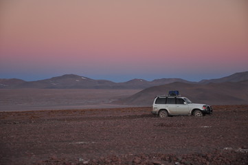 sunset in Bolivian desert snowy mountain 