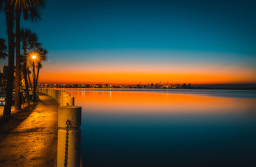 Obraz premium dawn water sea bay miami florida brickell sky clouds lighting beautiful impressions calm nature coast summer horizon orange blue