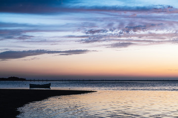 traditional fisherman wooden boat at dusk