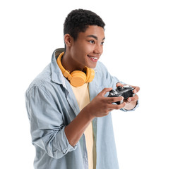 African-American teenage boy playing video game on white background