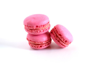 Macaroons are pink on a white background. Suitable for advertising backgrounds.