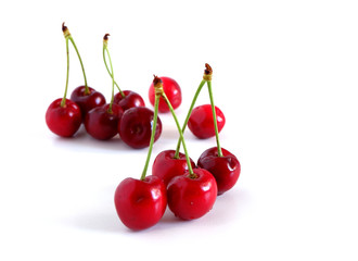 Obraz na płótnie Canvas Cherries on a white background. Suitable for advertising backgrounds. Vitamin complex
