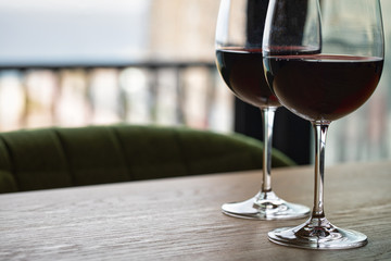 Luxury red wine. Delicious drinks, made from delicious grapes in wine glass on the table. restaurant close up. red wine on table. plate with wine on table. restaurant open. catering industry