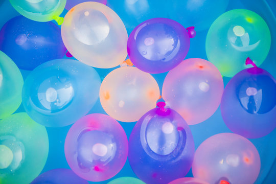 colored balloons floating in water
