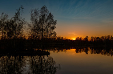 Beautiful sunset with reflections near Niederpöring, Isar, Bavaria, Germany
