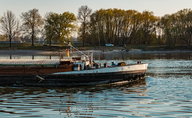 Beautiful spring view with reflections and freight ships near Metten, Danube, Bavaria, Germany