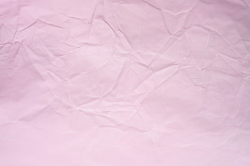 Pink crumpled paper background. Crumpled smooth paper texture top view. Abstract pink Background for Design. copy space