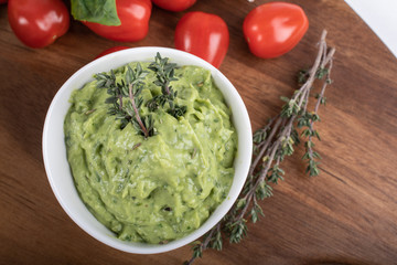 Gluten-free fresh cooked penne pasta from green peas isolated on wooden board. basil