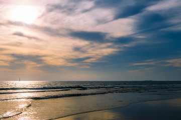 beach with calm sea and spectacular sky at sunset
