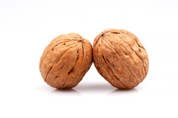 Delicious whole organic two walnuts, isolated on white background
