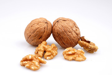 Useful organic walnuts, close-up, isolated on white background.