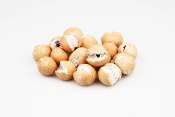 Salted peanuts with a little sauce on white ground