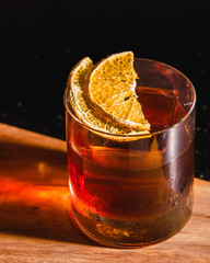 glass of whiskey on a wooden table