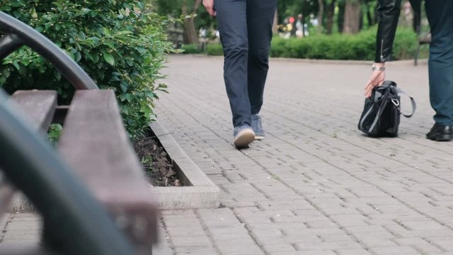 Terrorist leaving a bomb bag in a public place preparing to detonate it