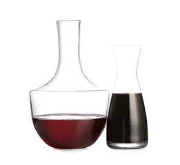 Decanters of wine on white background