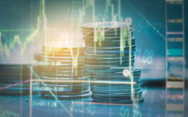 Double exposure of graph , stationary and rows of coins for goal office , finance and business concept background and forex trading graph with economy trends business or finance background.